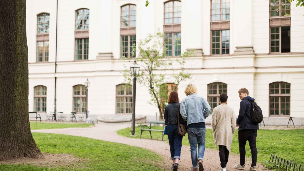 tudents walking towards university campus representing Scholarships in Germany