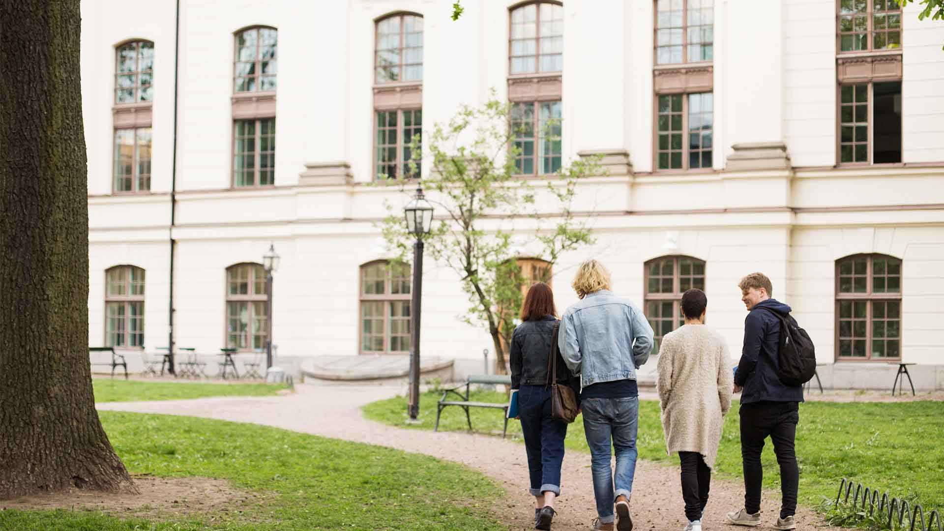 tudents walking towards university campus representing Scholarships in Germany
