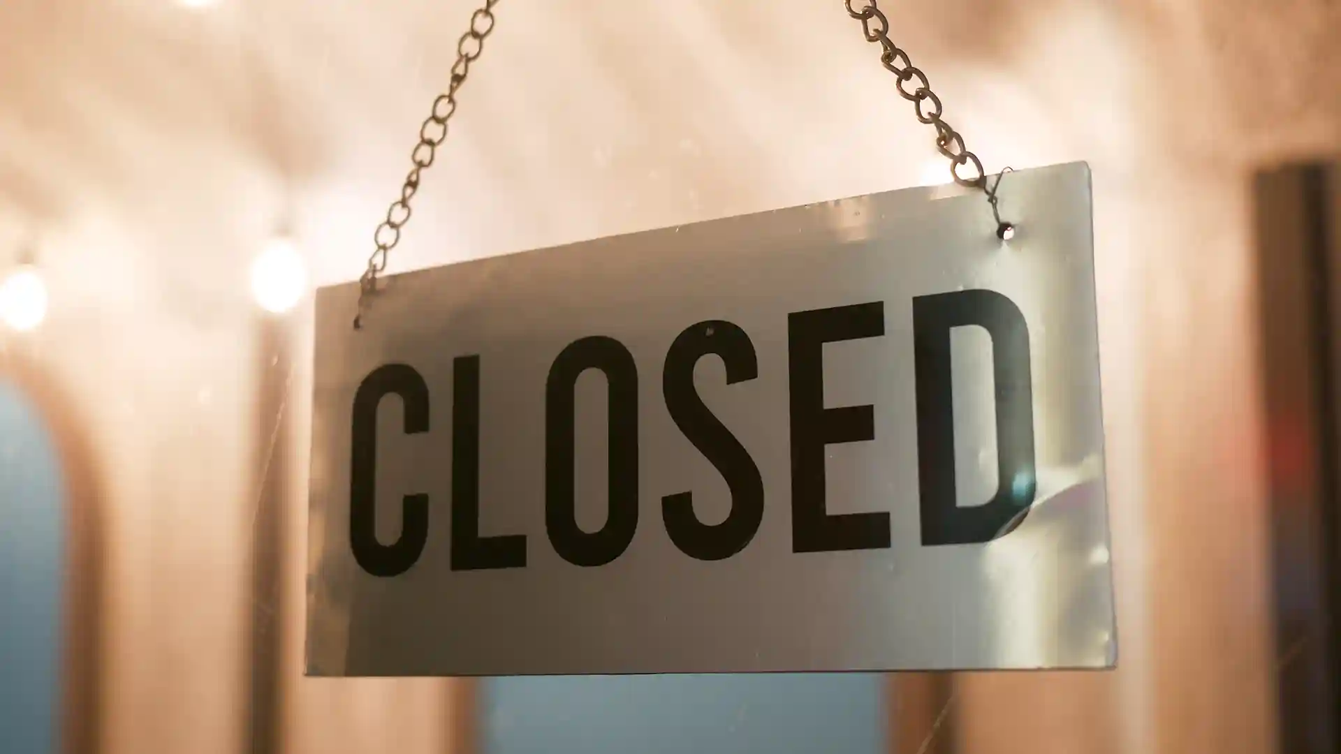Glass door with a closed sign at a store during Public Holidays in Berlin