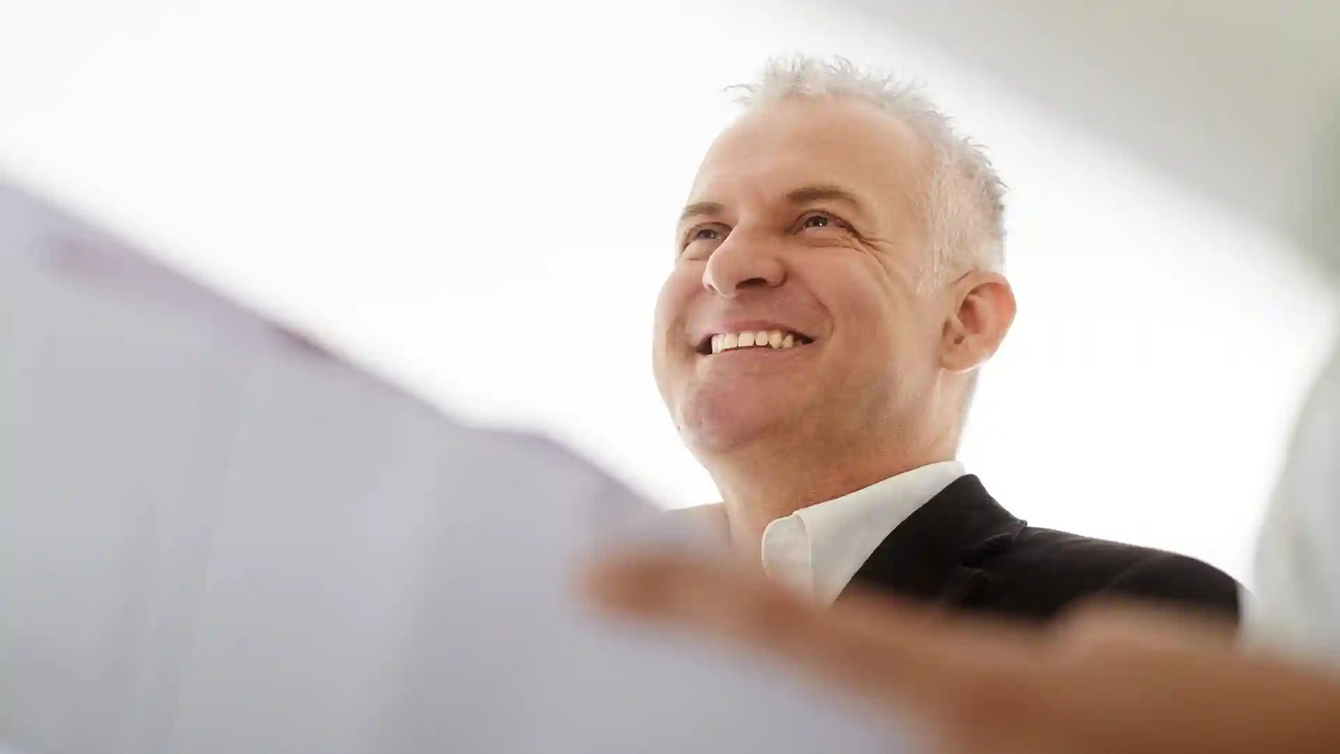 a middle aged man being portrait as a professional, the opposite of Poor Work Ethic in Germany