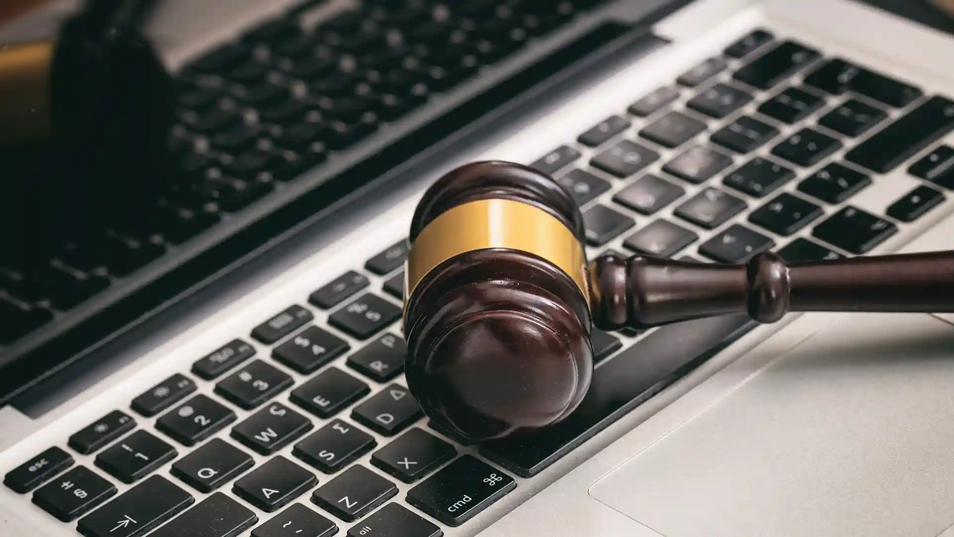 judge gavel on a laptop symbolizing the legal problems of Using Torrent in Germany