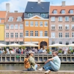 Expat Life in Denmark: copenhagen couple in canalside are chatting