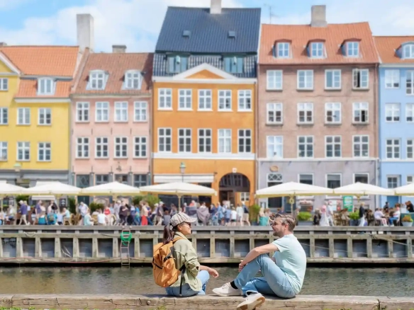 Expat Life in Denmark: copenhagen couple in canalside are chatting