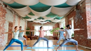 People practicing yoga in a bright Berlin studio, representing the vibrant and diverse yoga community at the best yoga studios in Berlin.