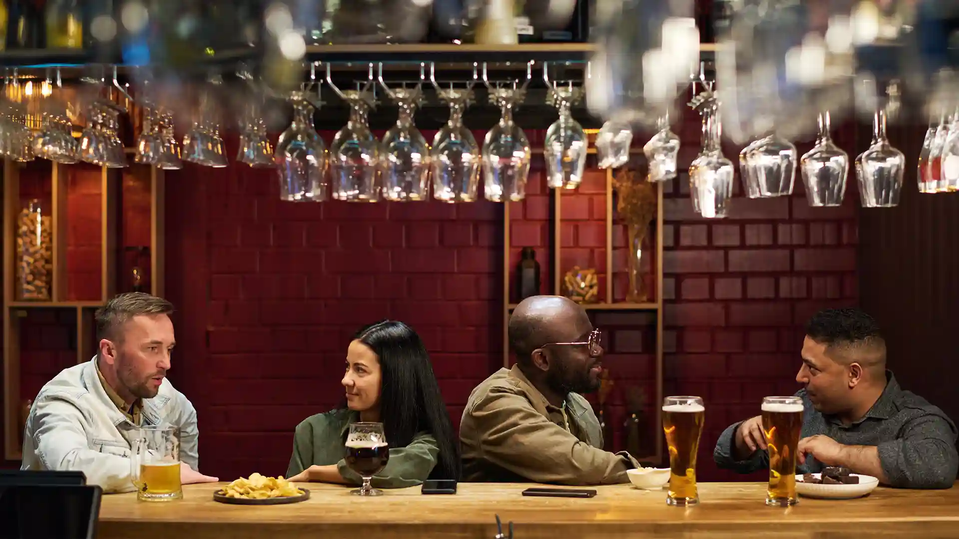 People enjoying drinks at a lively brewerie in Berlin, representing the vibrant atmosphere of the best breweries in Berlin.