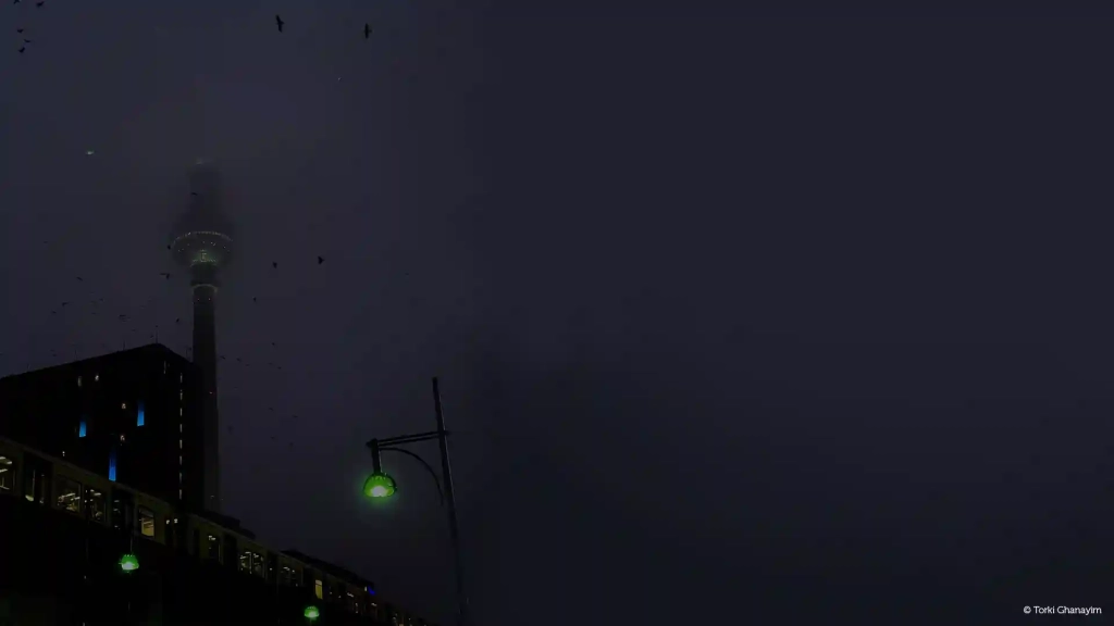 Alexanderplatz in fog at night, captured by Torki for the article 'Overrated Places in Berlin' on the KUMMUNI Blog.