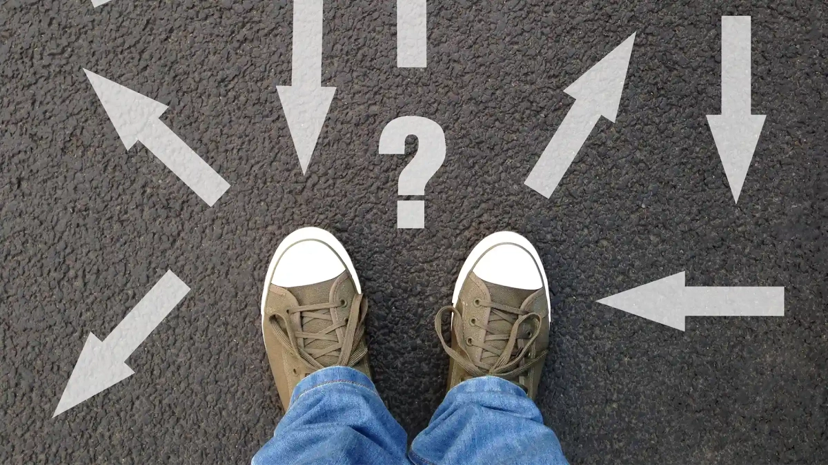 feet standing on asphalt with multitude of arrows, trying to choose between the List of Ausbildung Programs in Germany