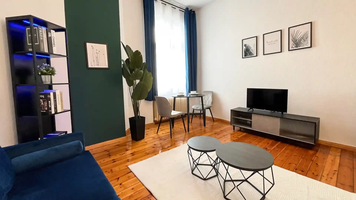 Stylish furnished apartment in Berlin offered by KUMMUNI, featuring modern furniture, wooden floors, and natural light—ideal for anyone looking to rent a furnished apartment in Berlin.