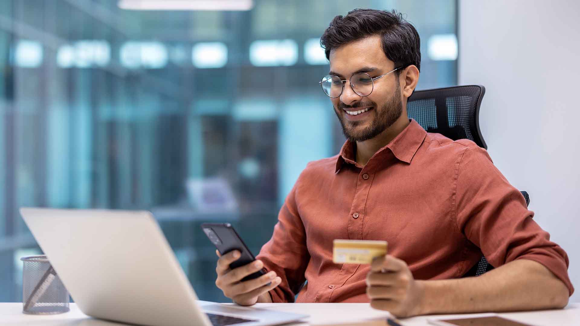 Indian student managing finances online while researching the Best Blocked Account in Germany for student visa and living expenses.