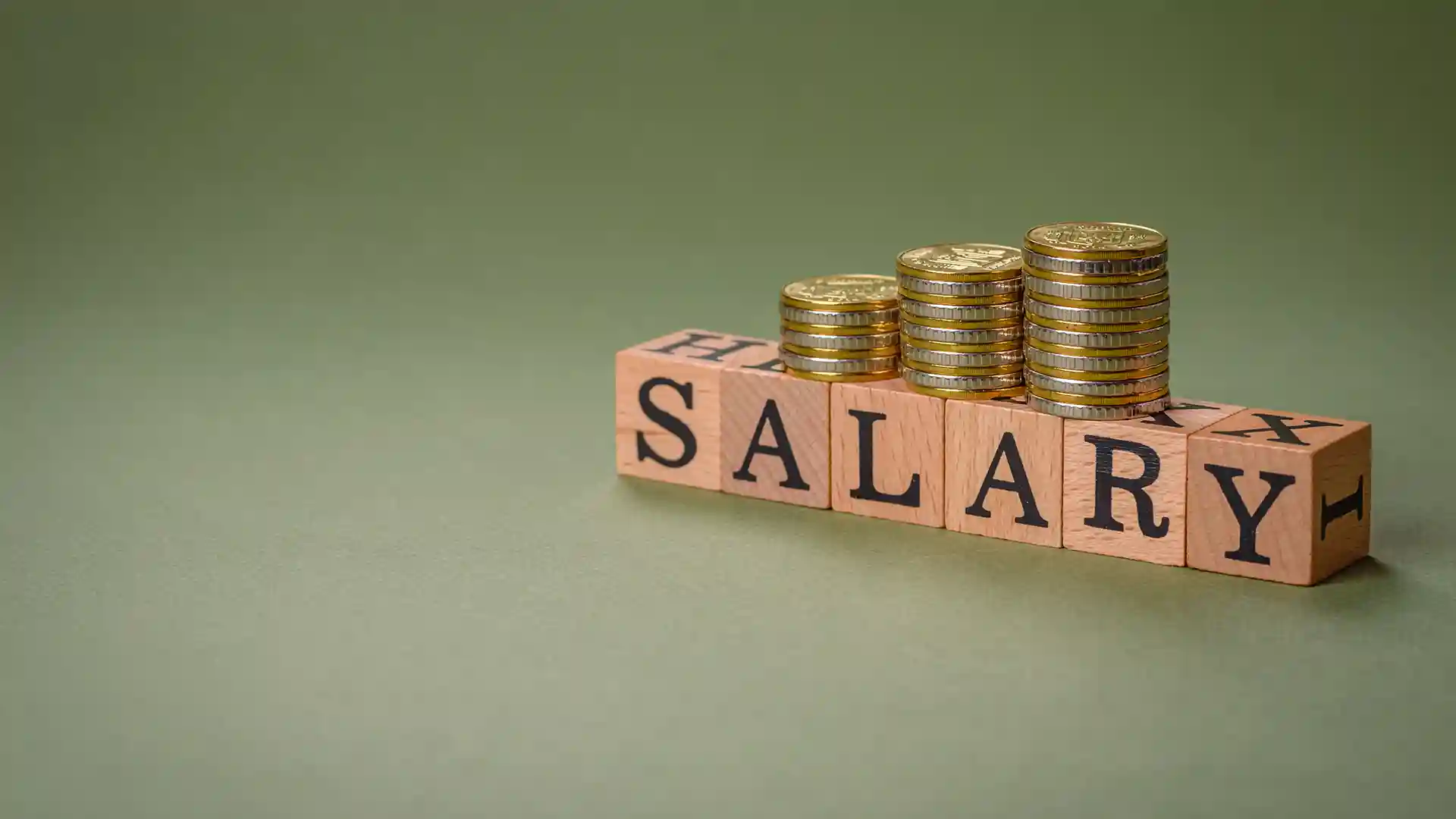 Stack of coins representing Germany vs USA Salaries, illustrating income comparison and financial differences for workers and expats.
