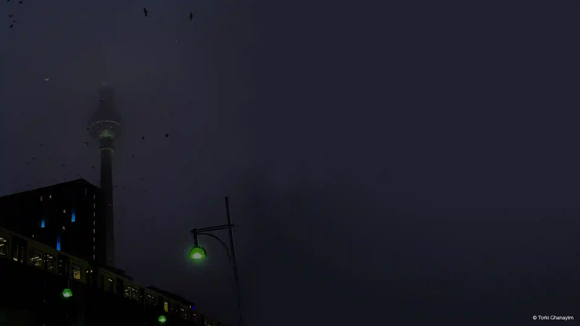 Alexanderplatz in fog at night, captured by Torki for the article 'Overrated Places in Berlin' on the KUMMUNI Blog.