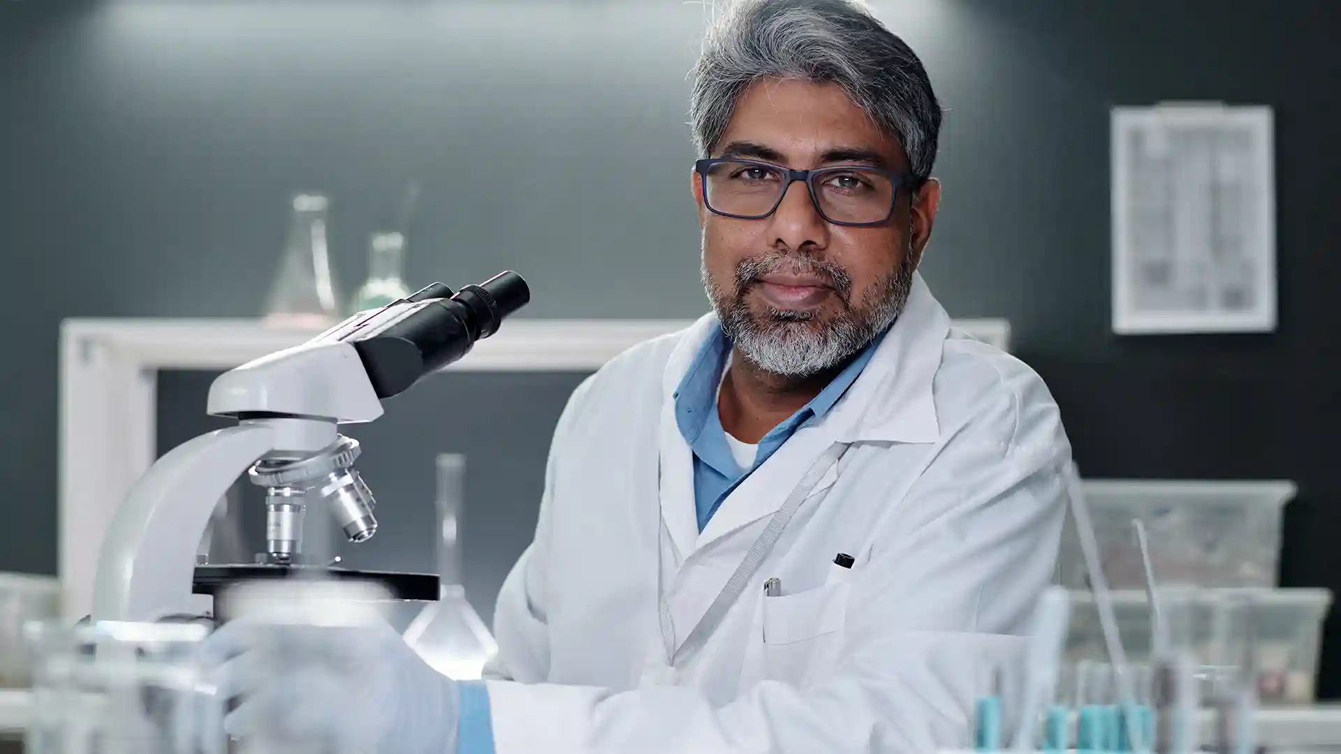 Indian skilled worker in a laboratory representing work in Germany